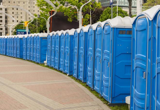 hygienic portable restrooms lined up at a beach party, ensuring guests have access to the necessary facilities while enjoying the sun and sand in Crystal Springs FL